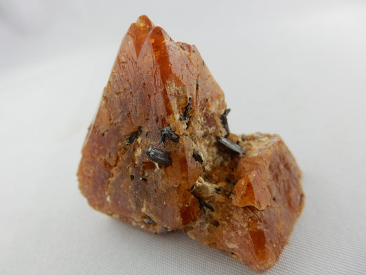 gemmy dark orange octahedron cluster of Scheelite with muscovite skin - two pyramids