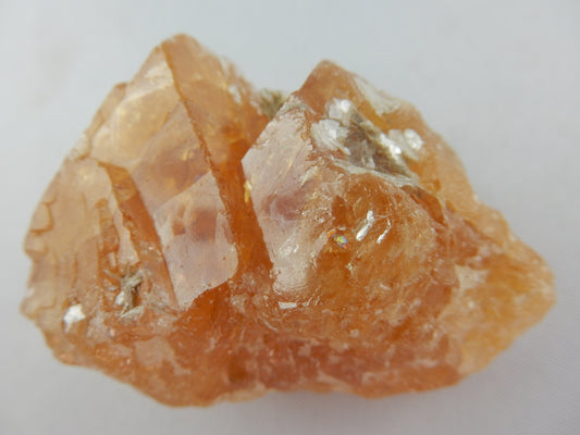 big gemmy orange octahedron cluster of Scheelite with muscovite skin