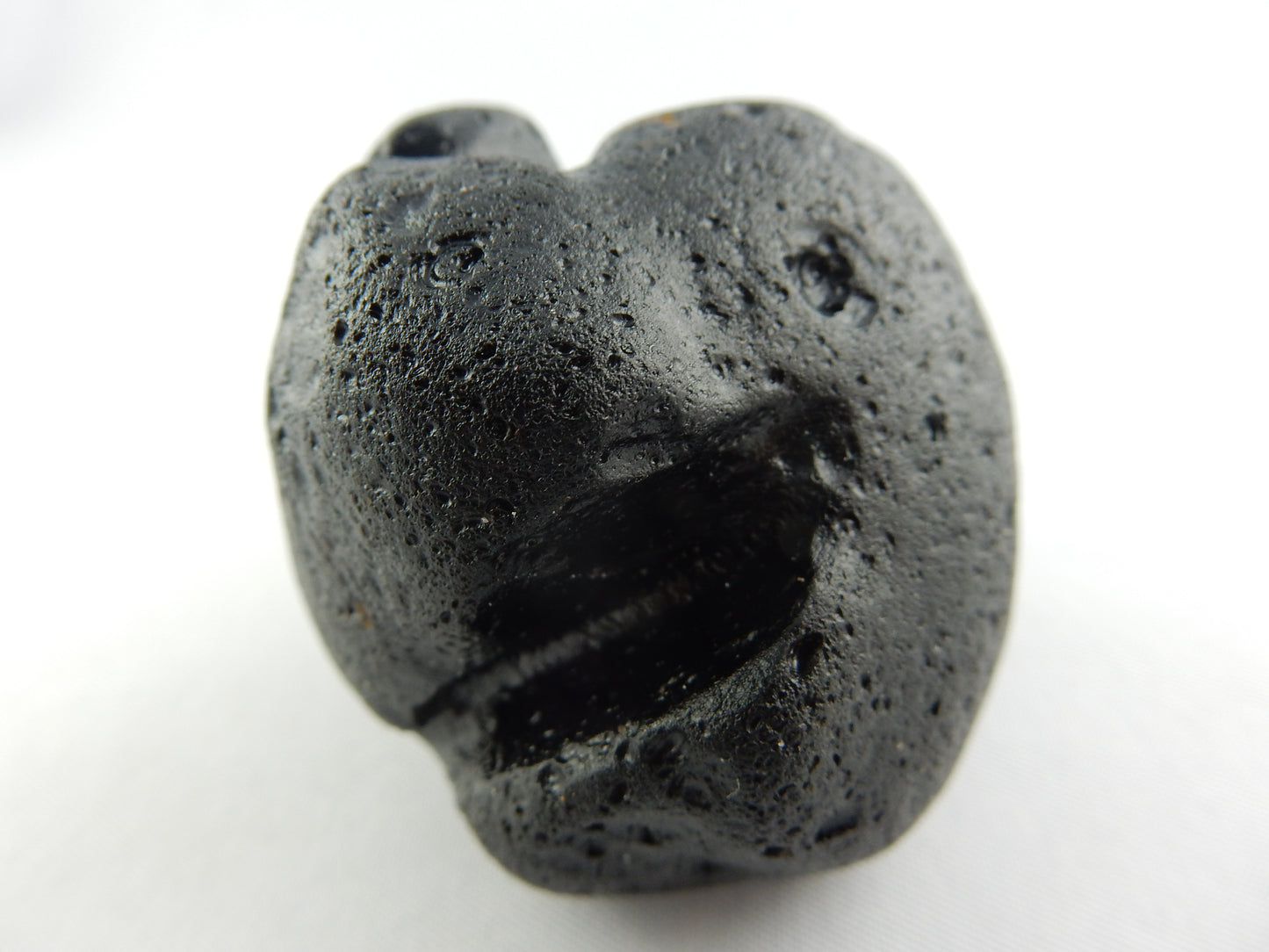 strange and rare - tektite only found on Phillippine island of Rizal - many theories on "worm-like" regoliths