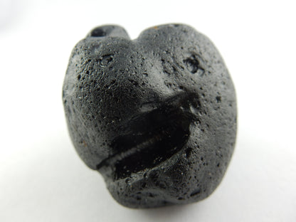 strange and rare - tektite only found on Phillippine island of Rizal - many theories on "worm-like" regoliths