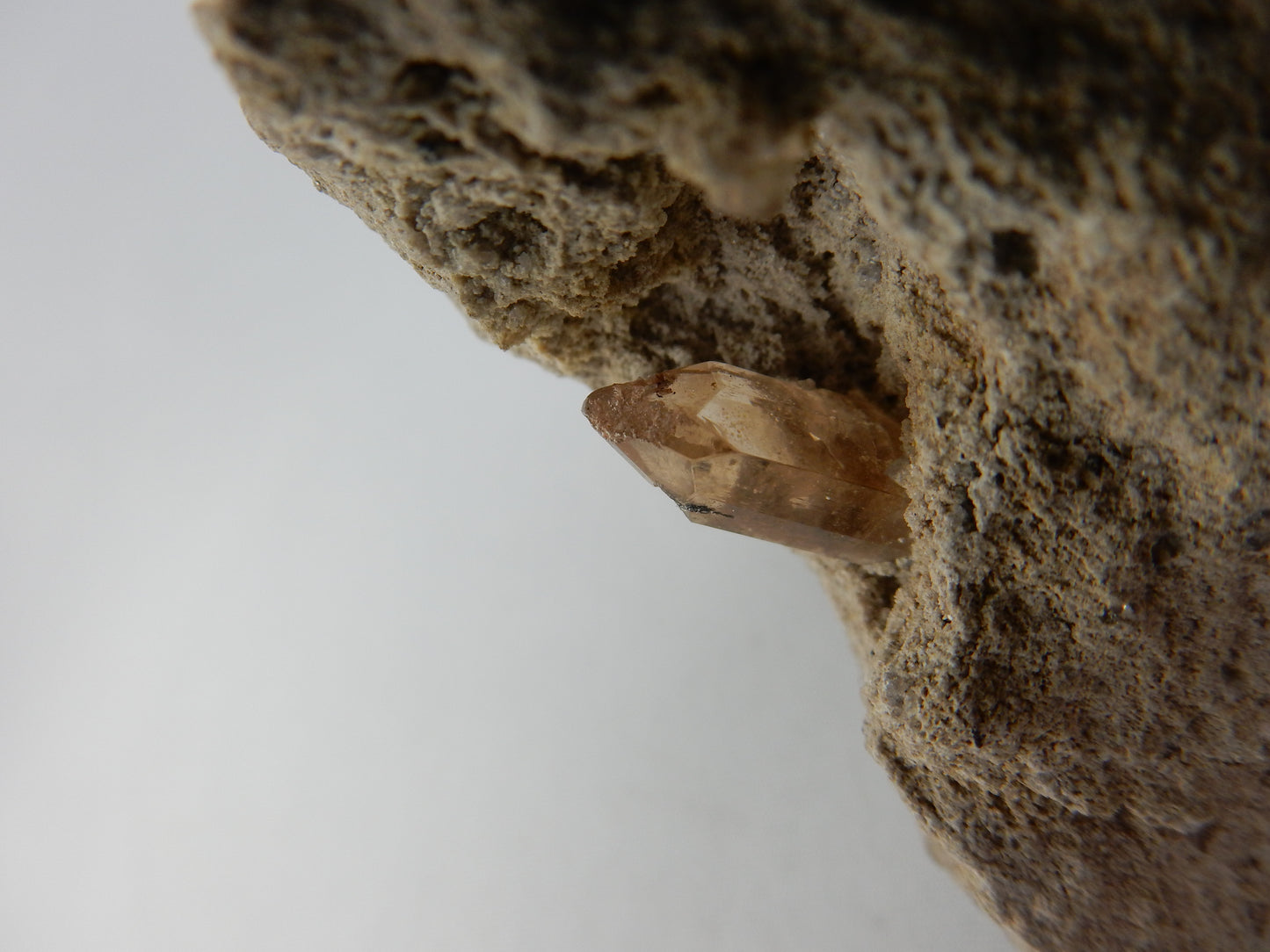 Topaz - gemmy single point in rhyolite vug - from famous Thomas Range location in central Utah