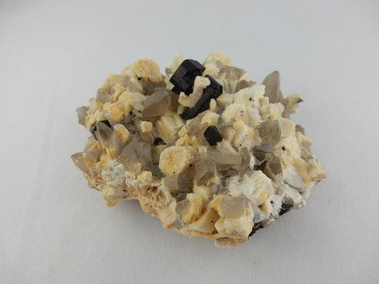 Very nice specimen plate of sharp terminated black tourmaline ("schorl") on bed of smokey quartz and feldspars