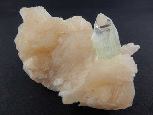 gemmy green Apophyllite sharp termination on bed of pink Stilbite