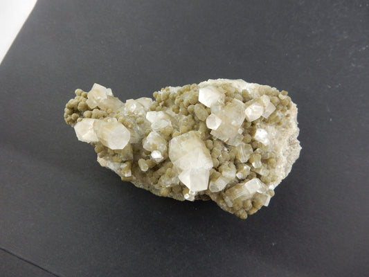 Gemmy apophyllite points on bed of relatively rare Gyrolite